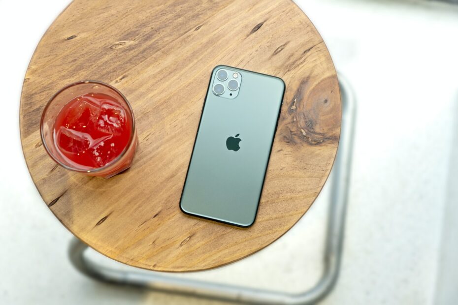 silver iphone 6 on brown wooden table
